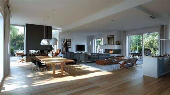 The open-plan living area flows out to a sun-drenched courtyard.